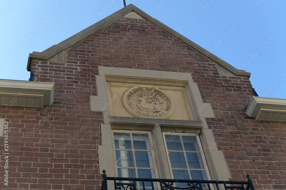 Obraz premium carved stone medallion featuring the old coat of arms for the former Village of Forest Hill, originally Forest Hill Fire Station, 641 Eglinton W, Toronto