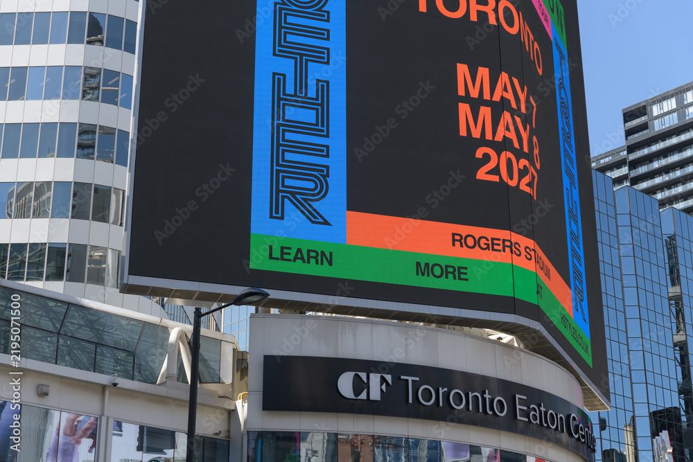 Obraz premium concert promotion for Harry Styles: Together, Together, featuring Lainey Wilson displayed on a digital spectacular at Sankofa Square, Toronto