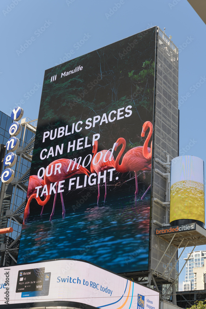 Obraz premium virtue signaling with a corporate budget: Manulife sponsor of environmental and community programs in an ad at Sankofa Square, Toronto (
