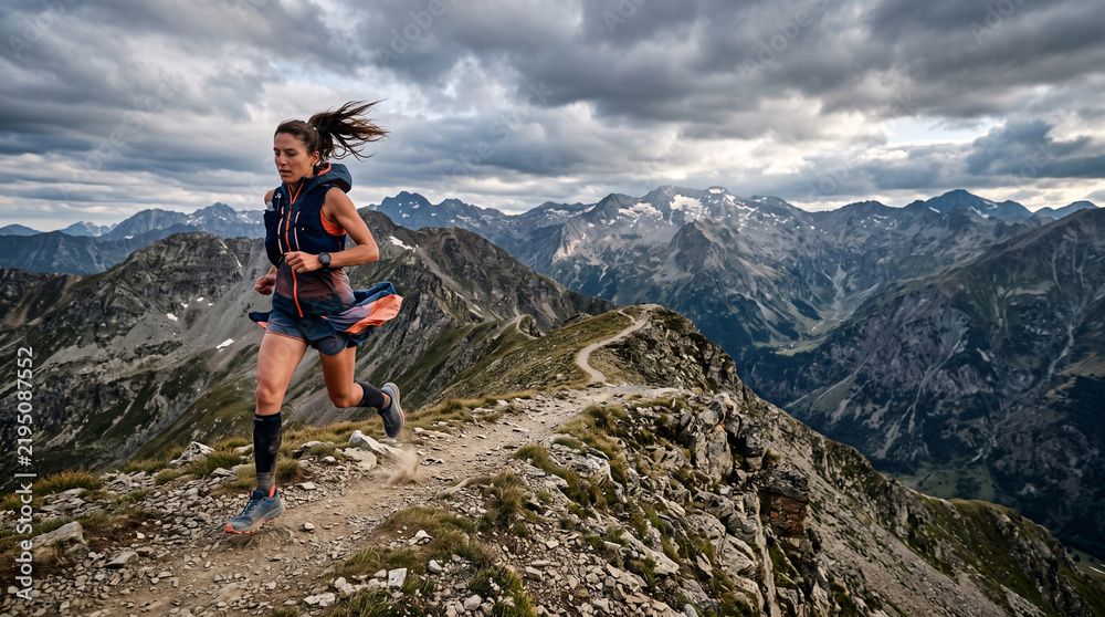 Obraz premium Female Runner Exploring Mountain Trail Adventure