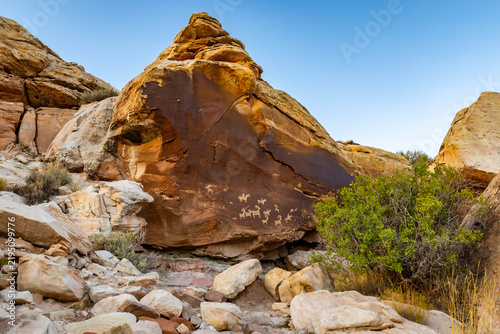 Historic Ute petroglyphs carved on sandstone along Delicate Arch trail