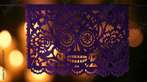 Deep Purple Papel Picado Skull Banner with Warm Candle Bokeh