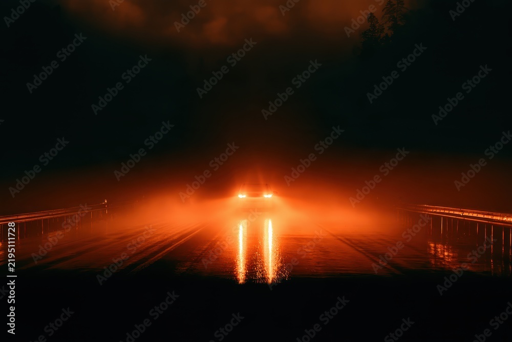 Obraz premium Headlights illuminate wet roadway on modern bridge at night with motion blur effect