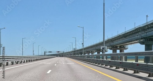 View from the car window on the right when driving on the bridge.