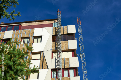 close-up of building corner during thermal insulation panel installation