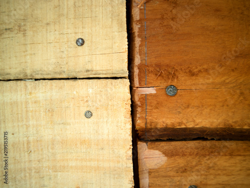 фотографія wooden wall texture in a wooden house building that uses nails to strengthen the