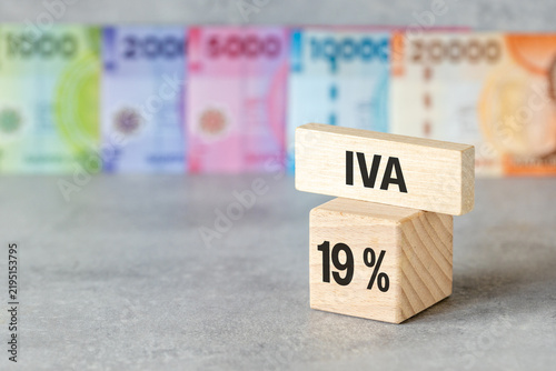 Obraz na plátne Tax reform concept in Chile showing value added tax reduction with text IVA 19 percent on wooden blocks