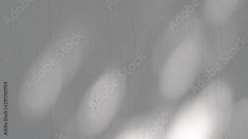 Abstract Moving Light and Shadows on Concrete Wall, Minimalist Atmospheric Background.