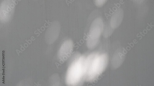 Abstract Moving Light and Shadows on Concrete Wall, Minimalist Atmospheric Background.