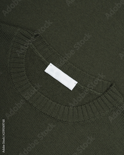 Bild auf Leinwand Olive green knitted sweater neckline close-up