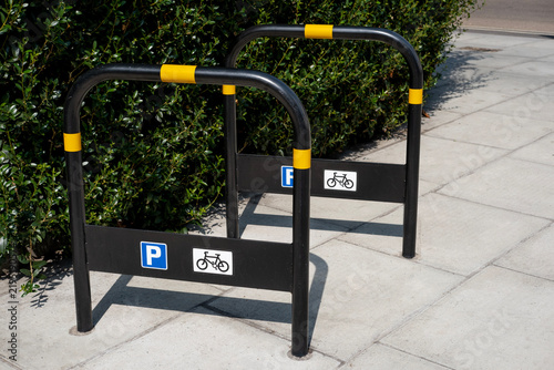 Canvas Print Two London bike stands on roadside pavement