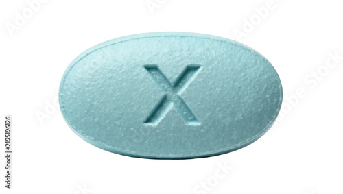 Foto Oval light blue pill with X imprint, isolated on transparent background