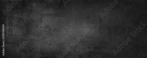 Dark grey black grunge textured concrete wall background