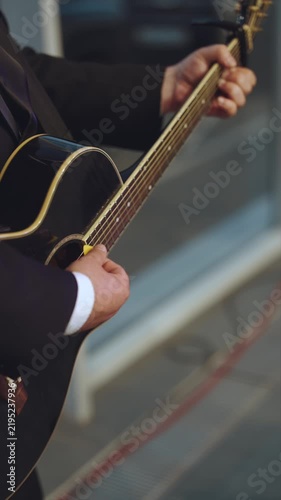 Playing the guitar, a guitarist’s performance, acoustic guitar