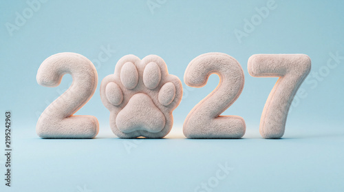 Cute animal paw print molded between white numbers two thousand twenty seven on a soft studio background. Professional pet grooming salon service, New Year.