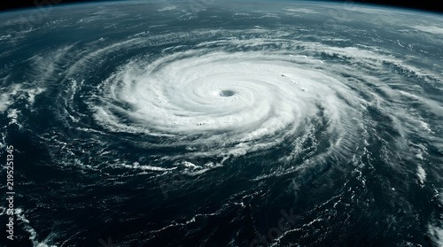 Hurricane seen from space with clear eye over ocean