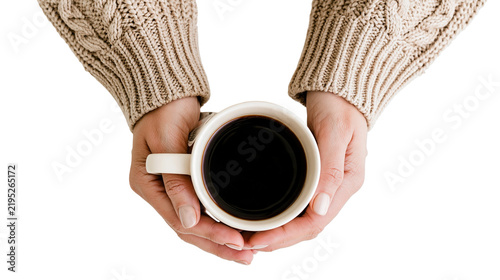 Isolated female hands holding a warm coffee mug, cozy and comforting drink for a cold autumn day