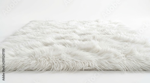 Soft white faux fur rug with long shaggy fibers on a plain background.