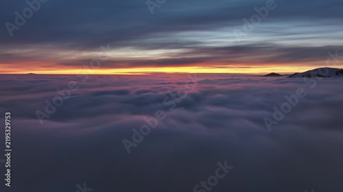 Dreamy flight over sea of clouds, real drone footage, beautiful colours, feels like heaven
