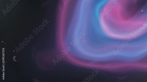 Abstract neon blue and pink light leak over dark background