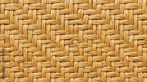Woven raffia palm pattern displays a textured natural surface