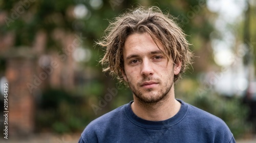 Authentic Young Man With Tousled Hair Outdoors Natural Light Portrait