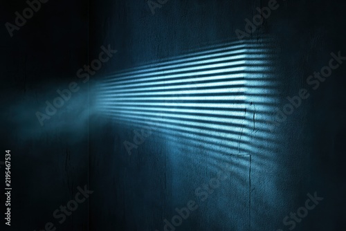 A dramatic blue light beam cuts through horizontal window blinds, casting stark shadows on a dark, textured wall, with dust illuminated in the smoky air