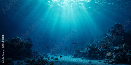 Underwater Coral Reef with Tropical Fish, Blue Ocean Water, Sunlight Rays and Deep Marine Life Beneath the Sea Surface for Nature and Aquatic Background Design