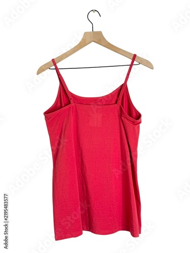 Fotografie Back view of a red women’s camisole tank top with adjustable thin straps displayed on a wooden hanger and isolated on a white background