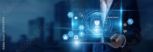 Fotografie Businessman Hand Holding Digital Tablet to Analyze Secure Coding Data and Applic