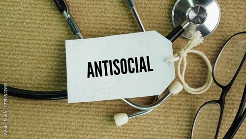 Bild auf Leinwand Stethoscope and paper tag with the word Antisocial means acting in a way that is