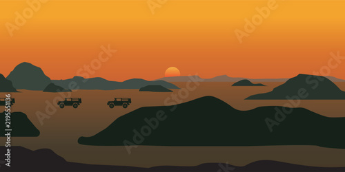 Silhouetted Buffalo Herd Grazing on African Sunset Landscape.