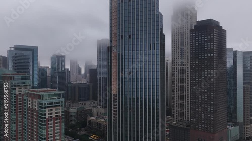  Aerial View of Chicago Skyscrapers Shrouded in Fog on a Gray Day”