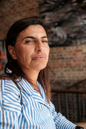 Photography Woman looking sideways wearing a striped shirt