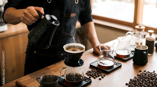 Barista preparing specialty coffee with pour over brewing equipment
