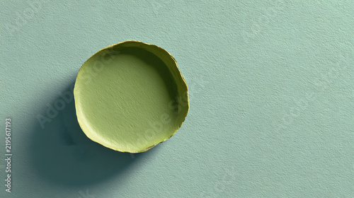 Green empty bowl with shadow on pastel textured surface for minimalist design