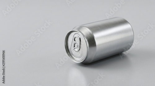Silver soda can - Unbranded beverage container on gray surface