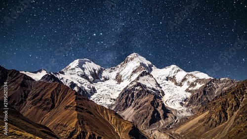 Majestic mountain peak against starry sky panorama landscape