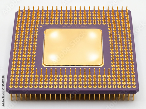 Obraz na płótnie Purple ceramic microprocessor with gold pins and heat spreader for high performance computing.