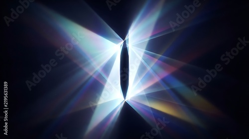 Stunning Light Beam with Prismatic Reflections and Colorful Rays Against Dark Background