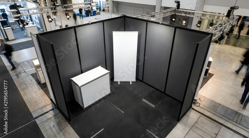Blank modular exhibition booth in large convention hall