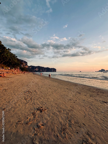 Dramatic Sunset at Ao Nang Beach with Silhouetted People, Krabi, Thailand