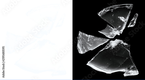 Fotografie Broken glass shards on black background, shattered transparent glass pieces with