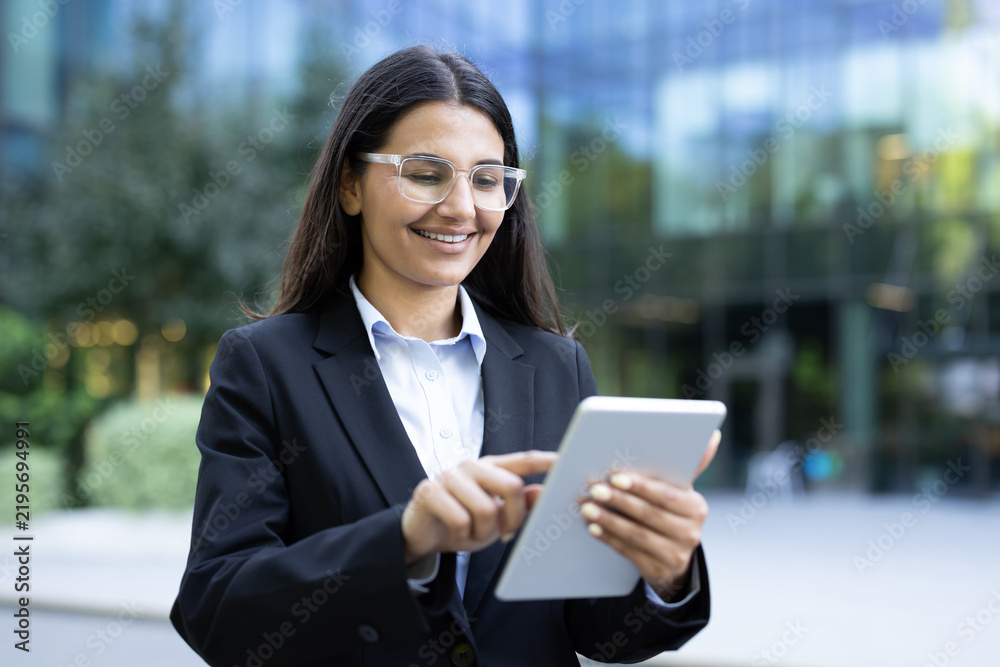 Obraz premium Business woman using digital tablet for remote work and corporate communication.