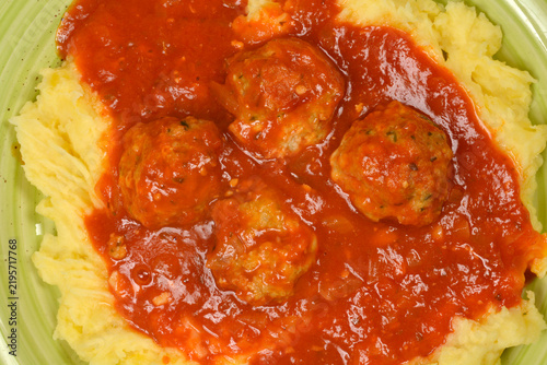 Obraz na płótnie A top down close up view of delicious homemade meatballs simmered in tomato sauc