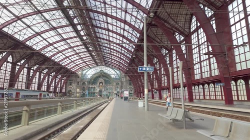 September 16, 2026 - Cinematic dolly shot along the platform of the historic and grand Antwerp Central Station in Belgium.