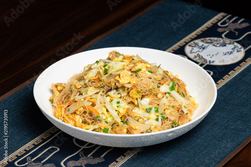 Sanshi Stir-fried Rice Noodles with Egg and Vegetables. Chinese Homestyle Close-up