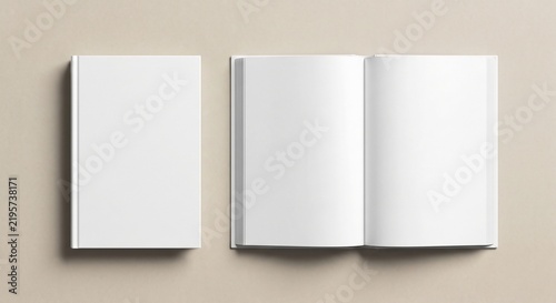Top-down flat lay of closed and open blank hardcover books on a neutral surface for product presentation.