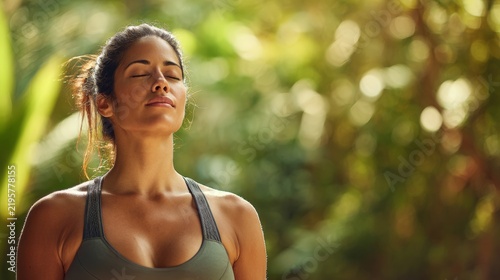 Woman practicing mindfulness in a green outdoor setting during daylight hours