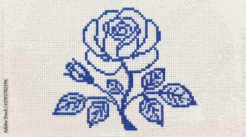 Foto A delicate blue rose and bud embroidered on white fabric, showcasing intricate stitching
